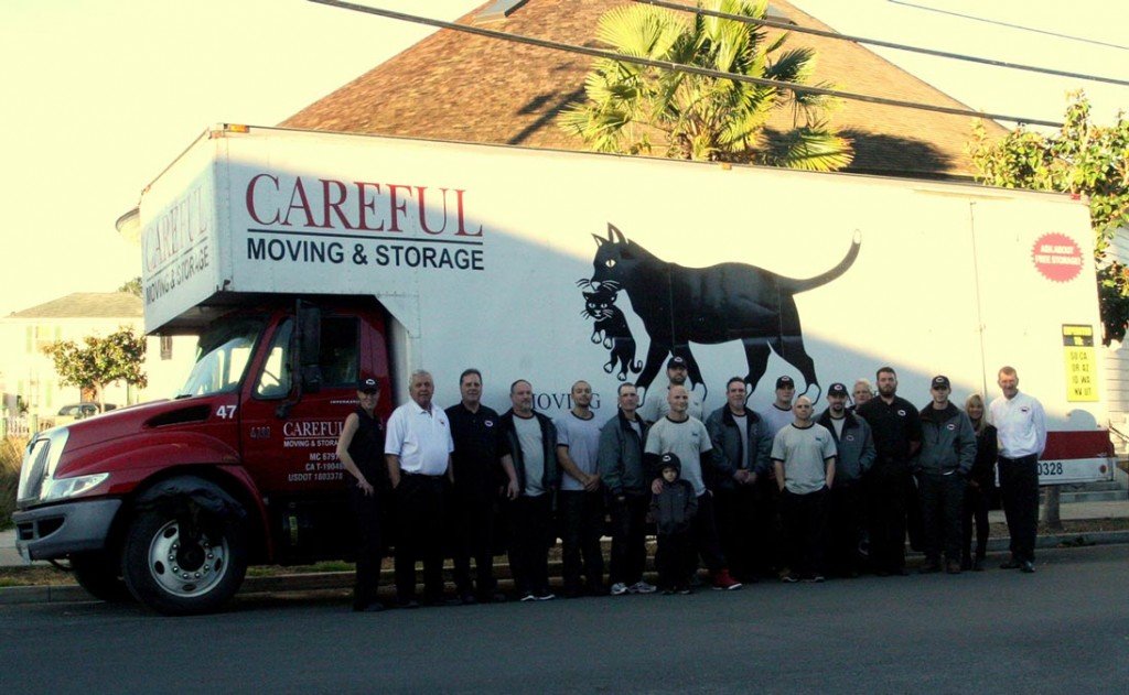 Careful Moving & Storage Employees in front of Moving Truck